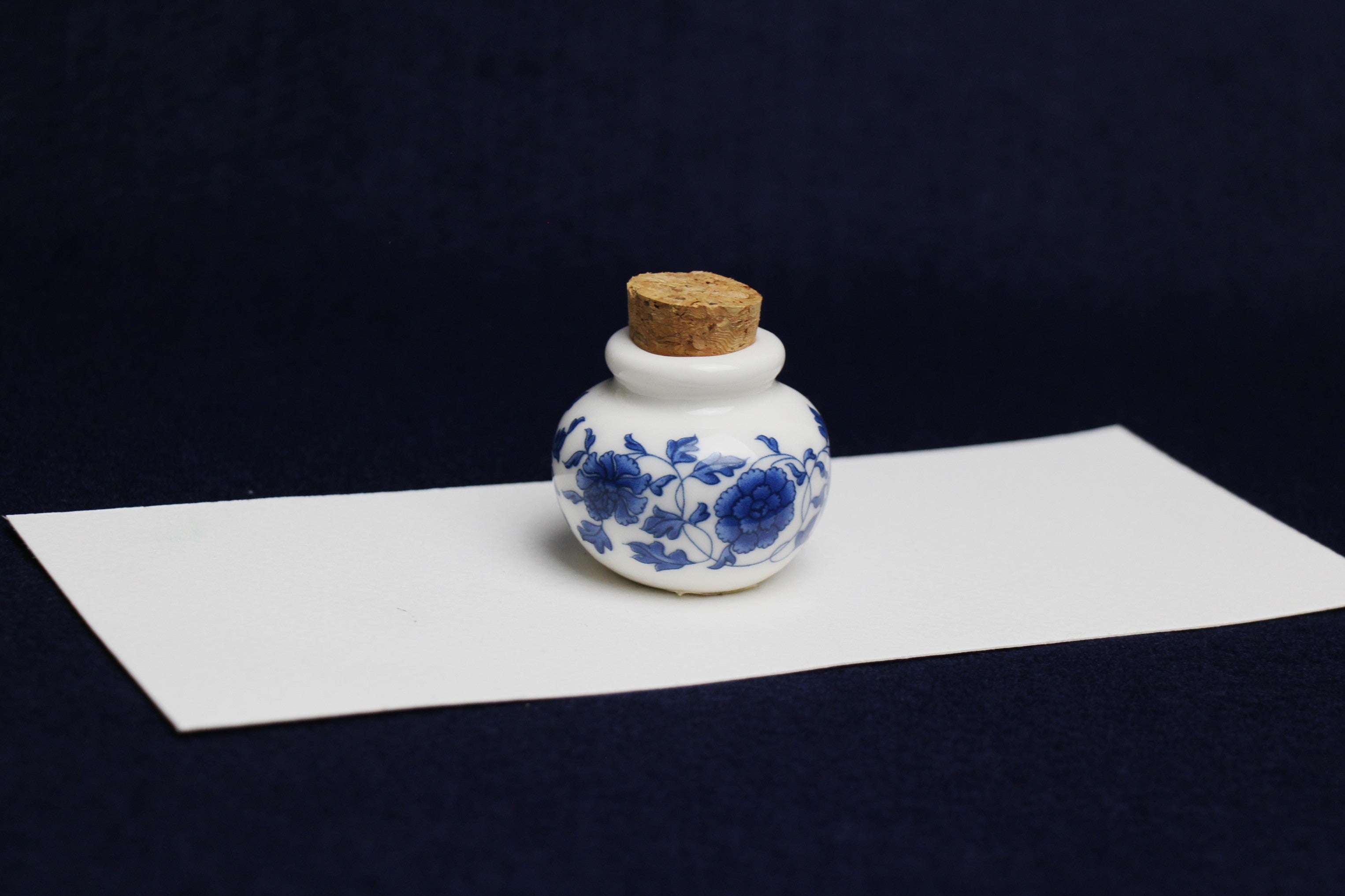 Small, white and blue ceramic inkwell with cork stopper (model 3)