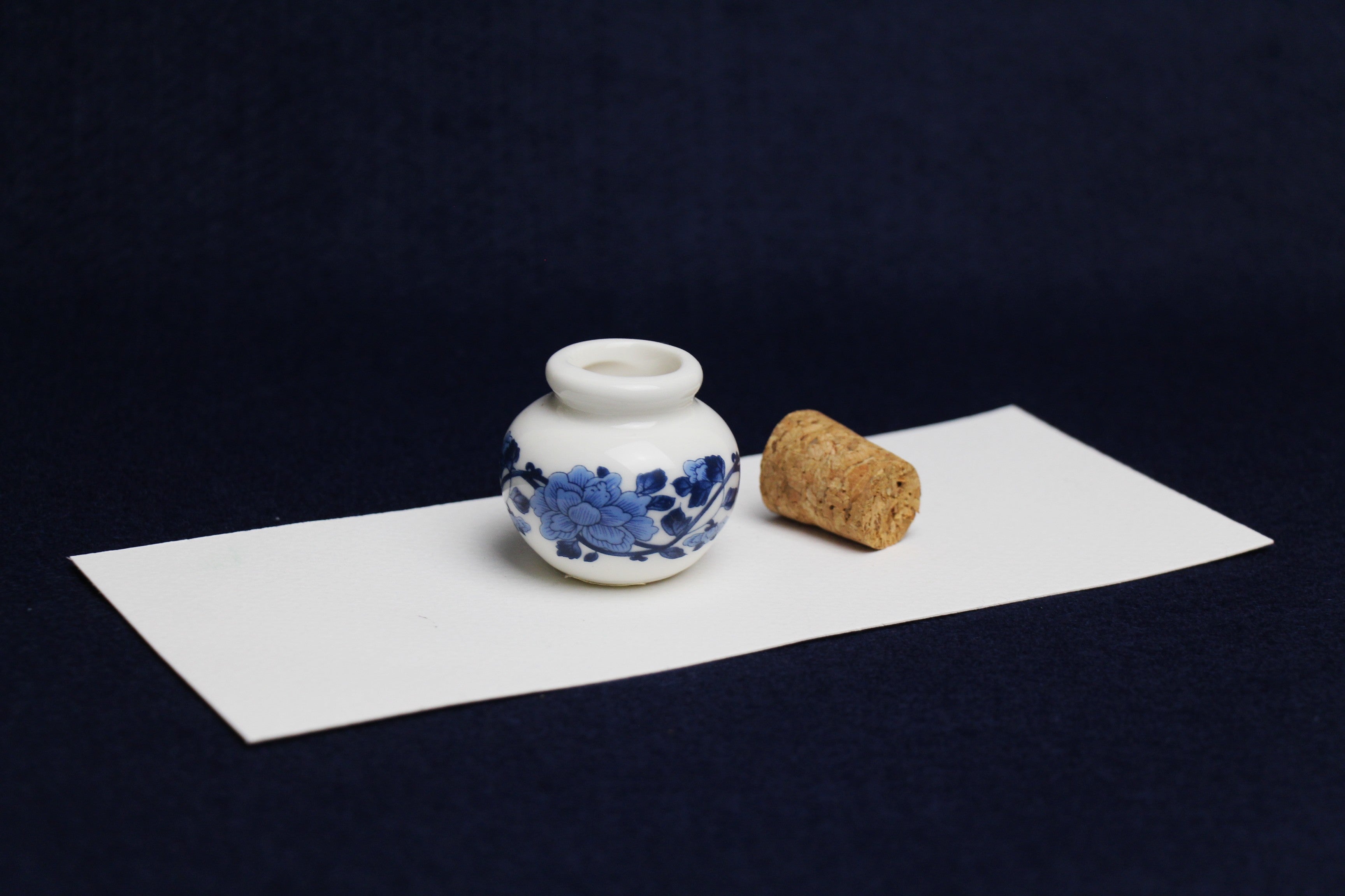Small, white and blue ceramic inkwell with cork stopper (model 4)