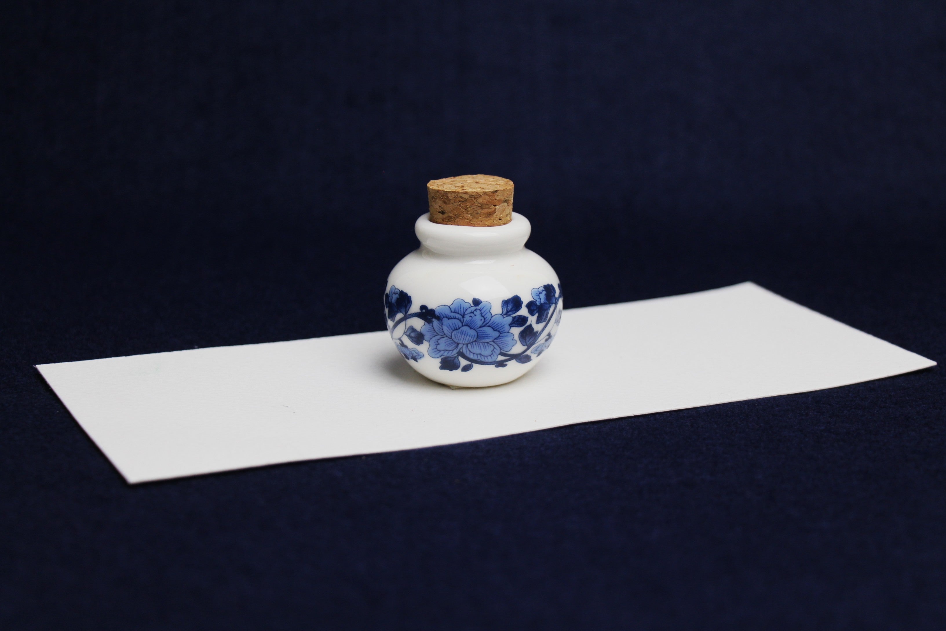 Small, white and blue ceramic inkwell with cork stopper (model 4)