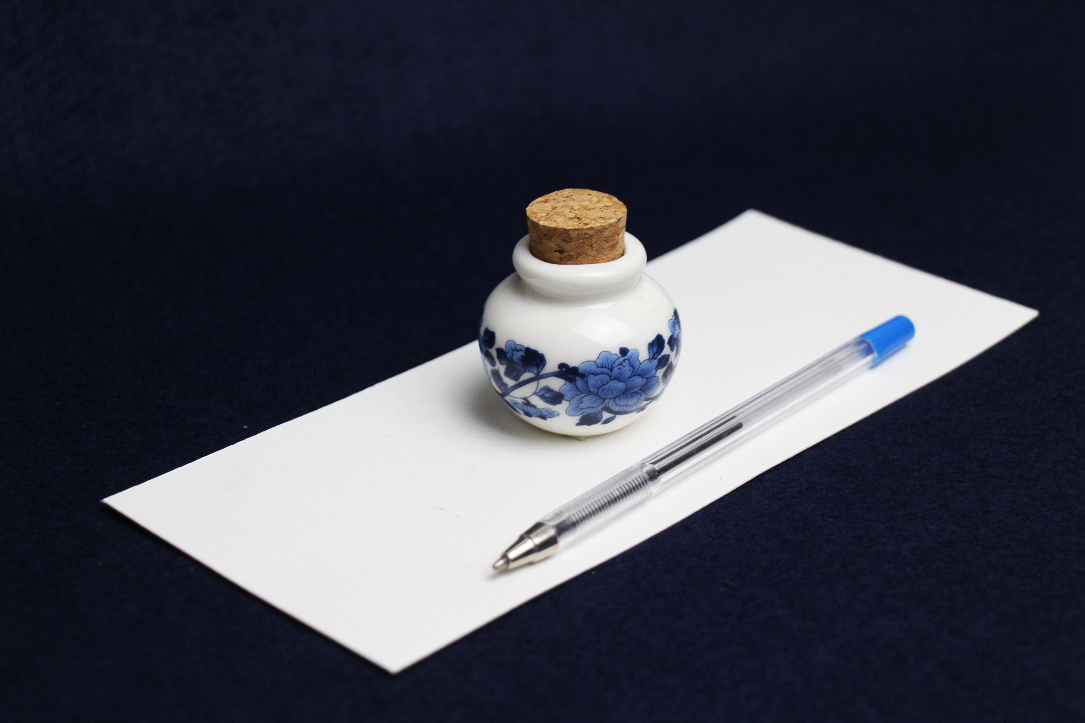 Small, white and blue ceramic inkwell with cork stopper (model 4)