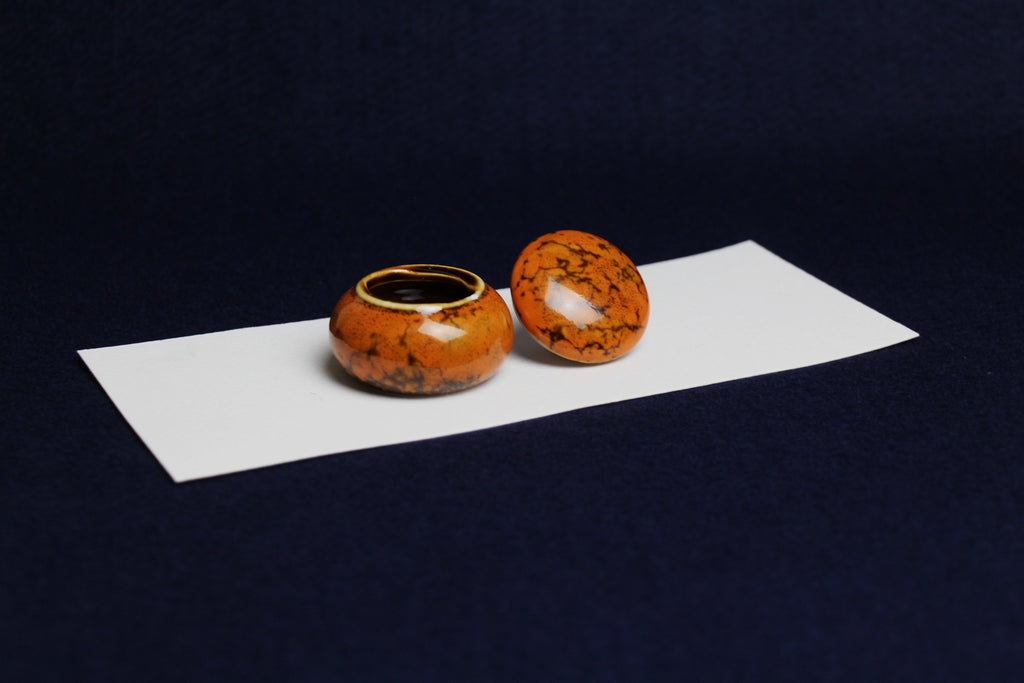 Small ceramic inkwell with twist-and-seal lid: orange marble, for Arabic calligraphy