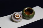 Load image into Gallery viewer, Small ceramic inkwell with twist-and-seal lid: dark sage green marble, for Arabic calligraphy
