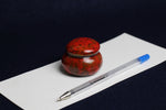 Load image into Gallery viewer, Small ceramic inkwell with twist-and-seal lid: red marble, for Arabic calligraphy
