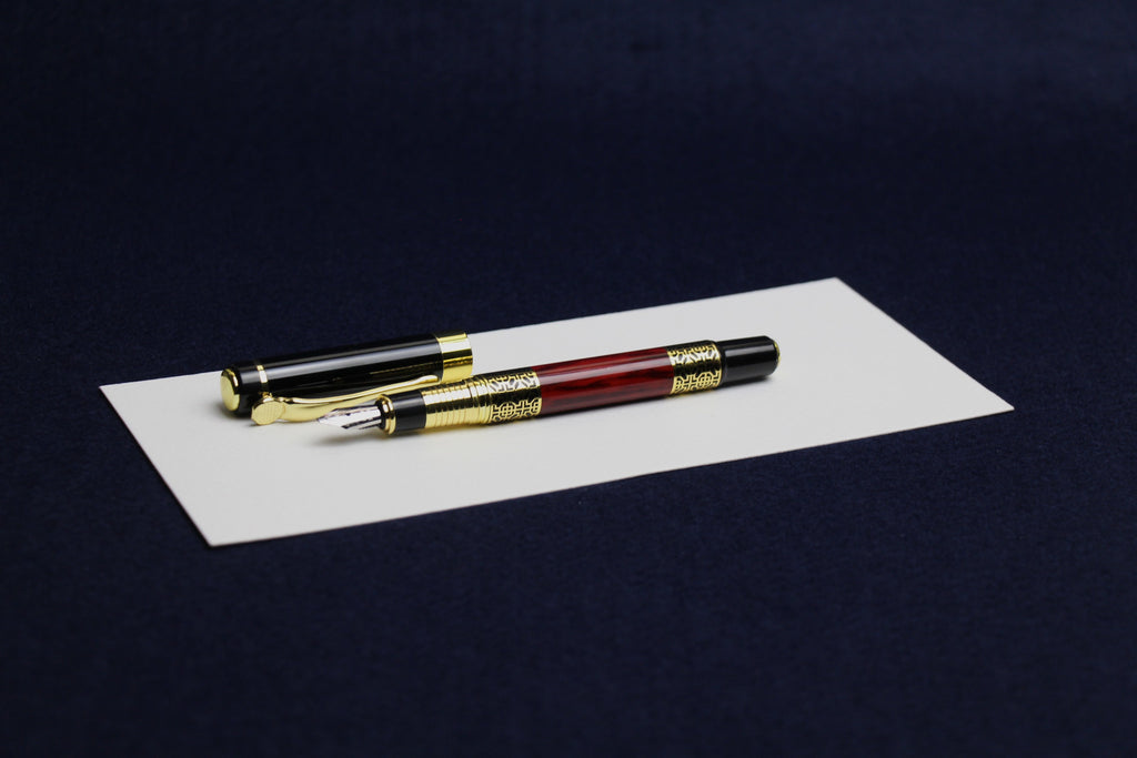 Unbranded fountain pen with left oblique nib for Arabic calligraphy - black and mahogony with gold geometric pattern 