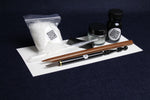 Load image into Gallery viewer, Small set for Arabic calligraphy - two dip pens with left oblique nib - Javi, handam, small glass inkwell with silk killa, black Indian ink in glass bottle, black metal pen rest and plastic transfer pipette
