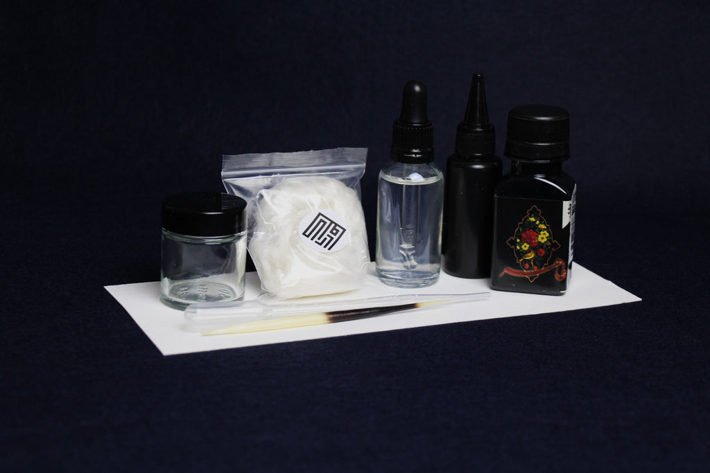 Ink kit: black water-based ink, inkwell, silk likka, rose water, water bottle, porcupine quill, transfer pipette