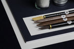 Load image into Gallery viewer, Medium set for Arabic calligraphy, 4 dip qalam pens with left oblique nibs, walnut ink, silk likka, inkwell, pen rest, notebook
