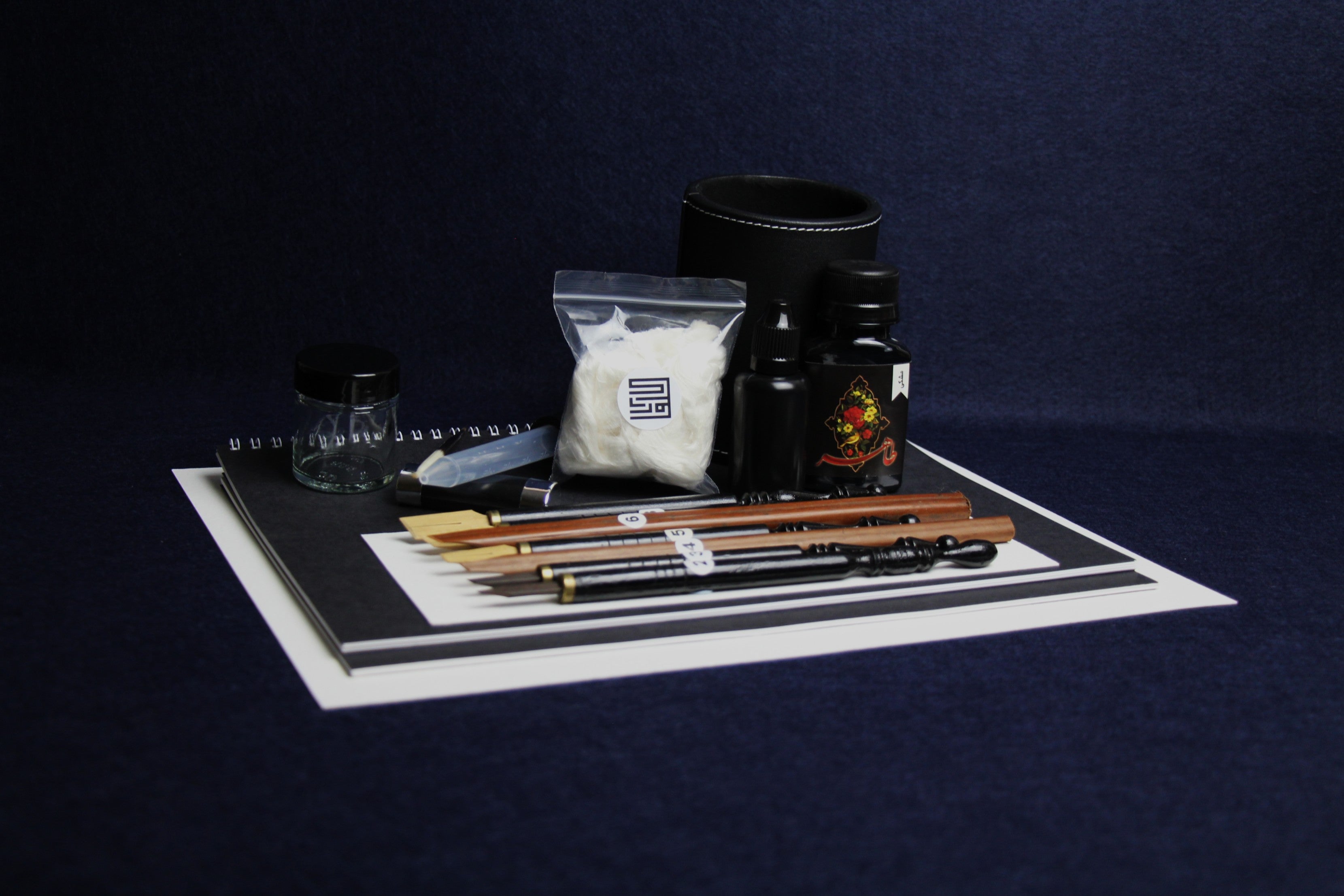 Large set for Arabic calligraphy - 7 dip pens, 2 notebooks, pen stand, black Taher ink, rose water, inkwell, silk likka, porcupine quill, transfer pipette, pen rest