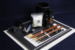 Load image into Gallery viewer, Large set for Arabic calligraphy - 7 dip pens, 2 notebooks, pen stand, black Taher ink, rose water, inkwell, silk likka, porcupine quill, transfer pipette, pen rest
