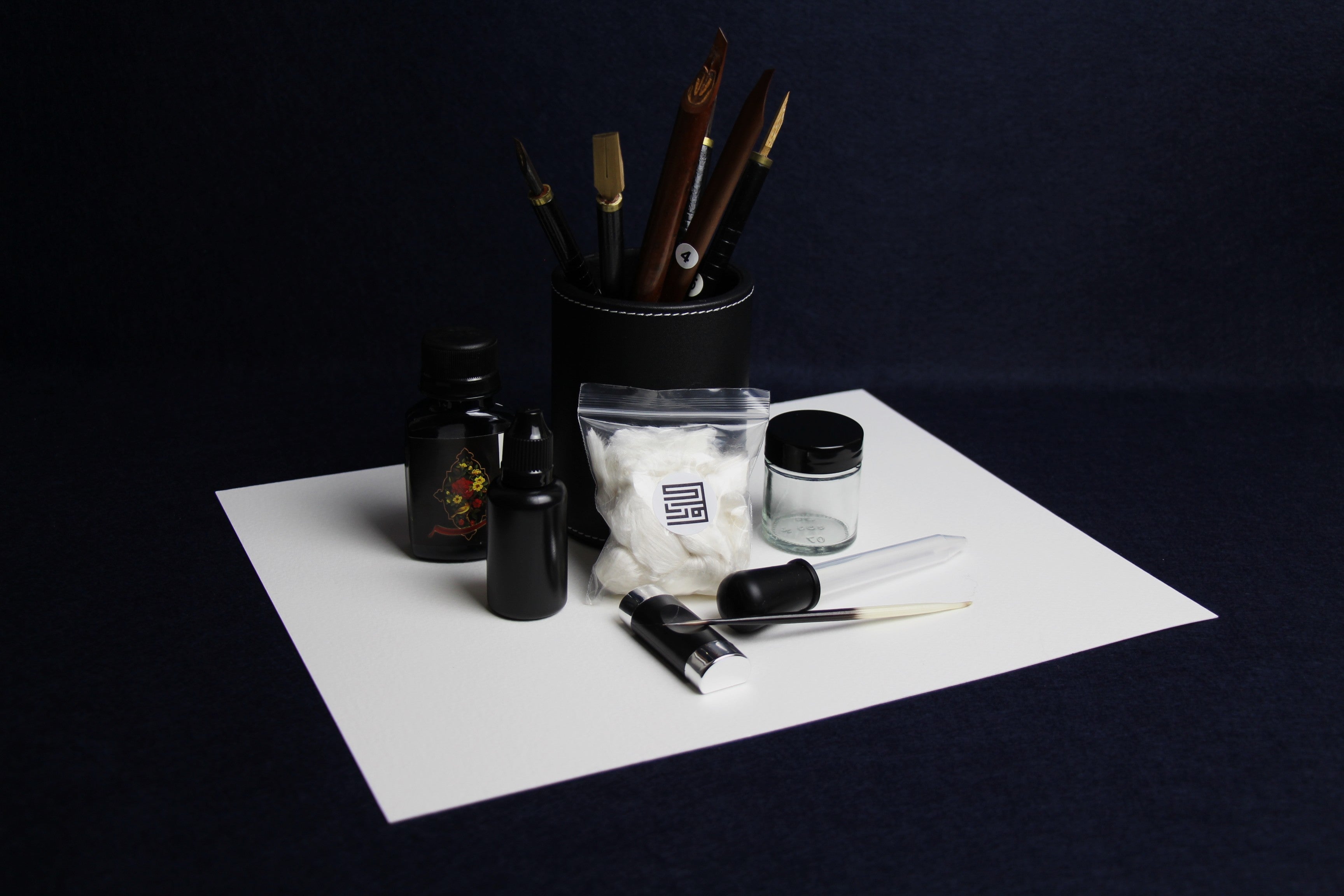 Large set for Arabic calligraphy - 7 dip pens, 2 notebooks, pen stand, black Taher ink, rose water, inkwell, silk likka, porcupine quill, transfer pipette, pen rest