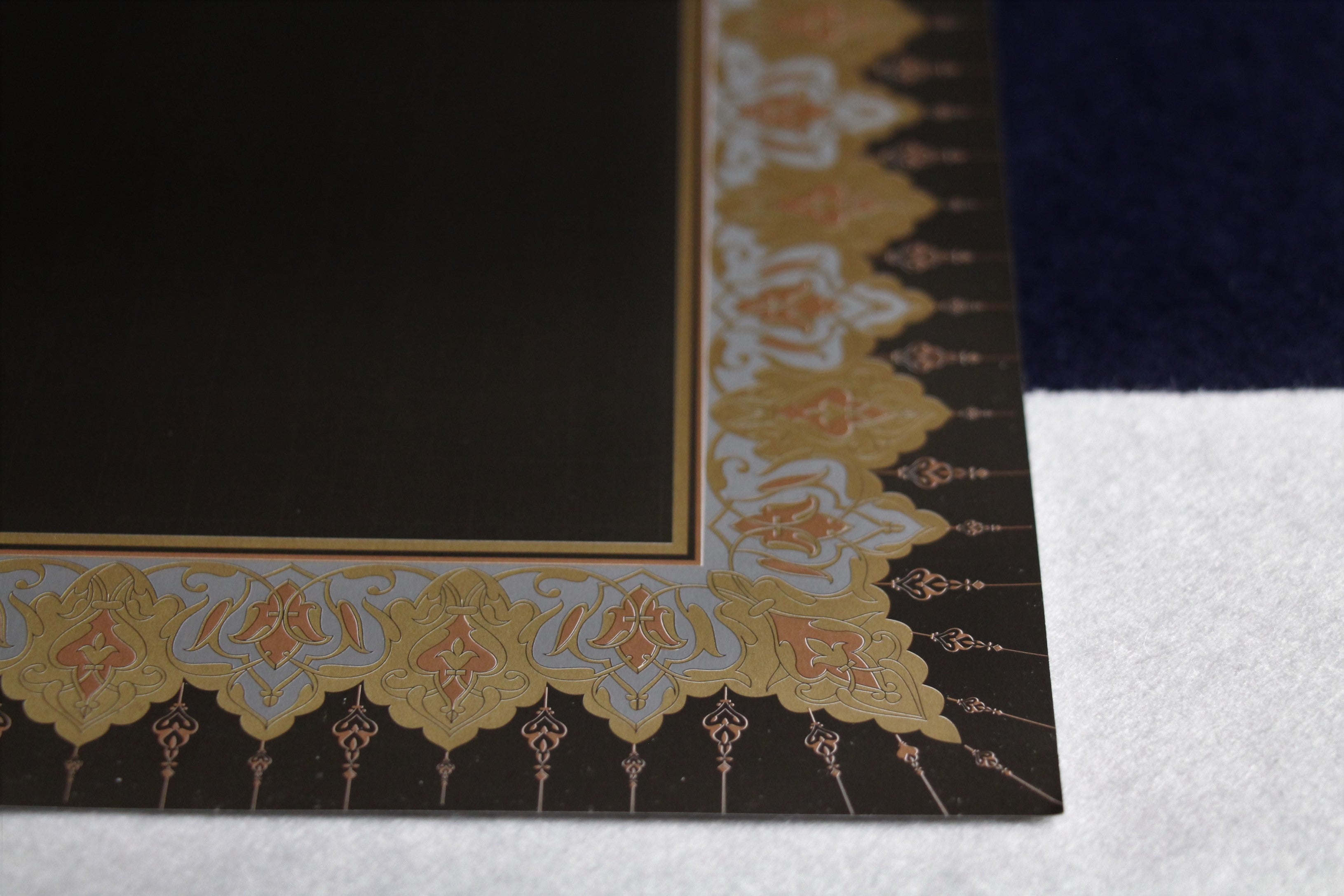 3 loose sheets of black glossy paper with copper border