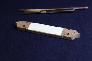 Large bone makta in wooden block for cutting pens for Arabic calligraphy